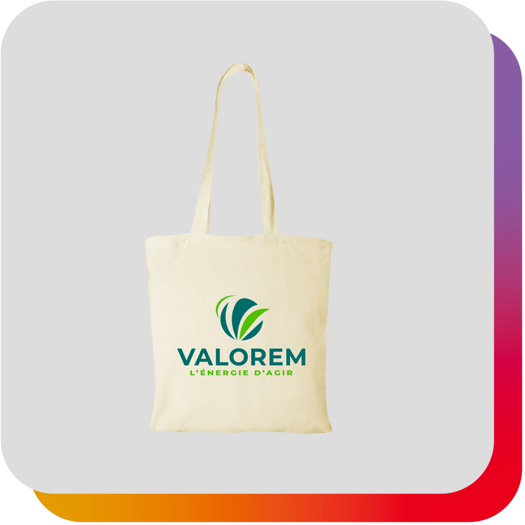 Fiche produit : Tote bag Valorem beige sur fond gris clair, avec signature arc-en-ciel en arrière-plan.